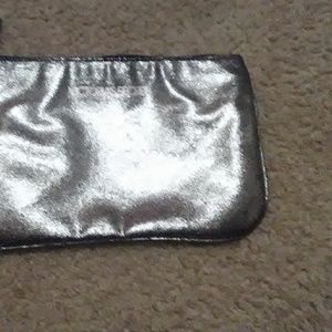 A small Victoria's secret makeup bag